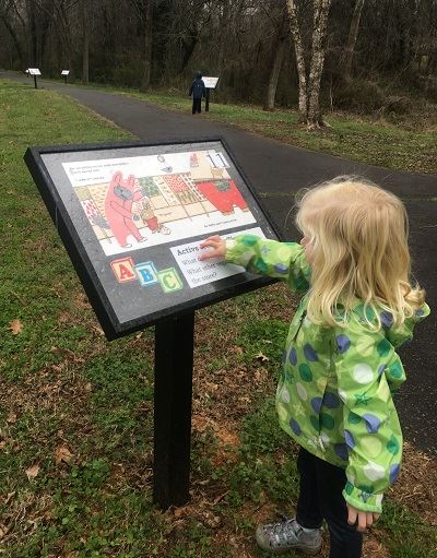 Child at StoryWalk